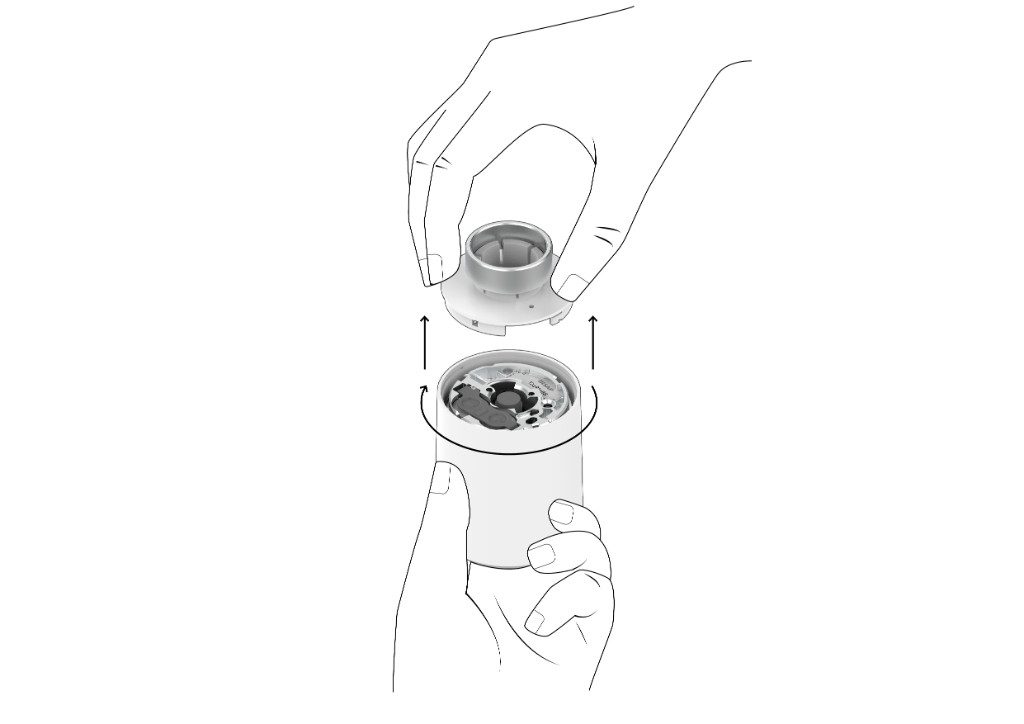 Desmonte la parte posterior de la válvula inteligente sujetándola con fuerza y ​​girando el dispositivo en el sentido de las agujas del reloj
